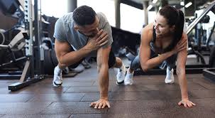 Toning Bingo Wings: Your Ultimate Guide to Sculpting Sleek Arms at the Gym 3 Fitness trainer demonstrating arm toning exercises Rayleigh